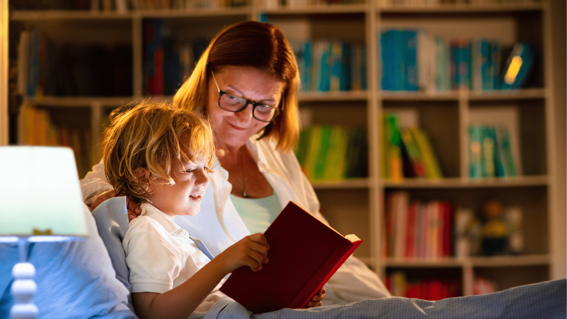 Woman and child sitting in a child's bed reading a book. Is melatonin safe for children?