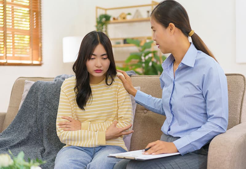 group of people sitting in a circle for alcoholics anonymous counseling