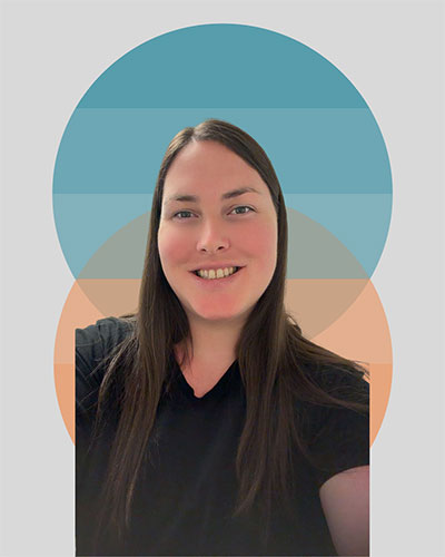 Person wearing a black shirt and smiling in front of colorful circular backdrop.